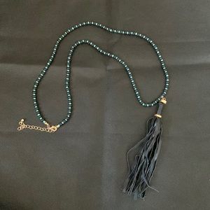 Beaded necklace with leather tassel